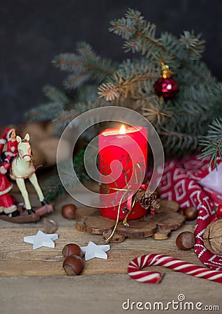 Christmas composition with a candle, fir branches and Christmas decorations Stock Photo