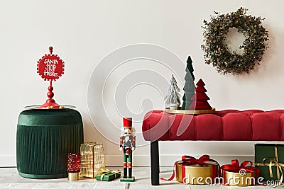 Christmas composition with decoration, christmas tree, gifts, snow and accessories in cozy home decor. Copy space. Stock Photo