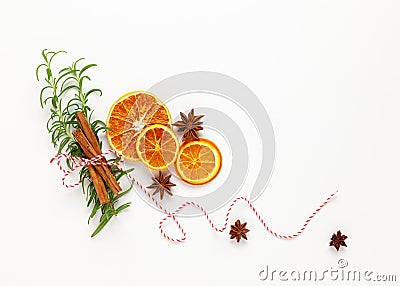 Christmas composition with dried oranges and spices on white background. Natural food ingredient for cooking or Christmas decor Stock Photo