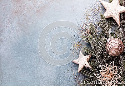 Christmas composition fir tree branches, gold sterne on blue background Stock Photo