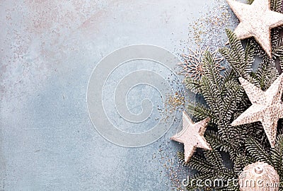 Christmas composition fir tree branches, gold sterne on blue background Stock Photo