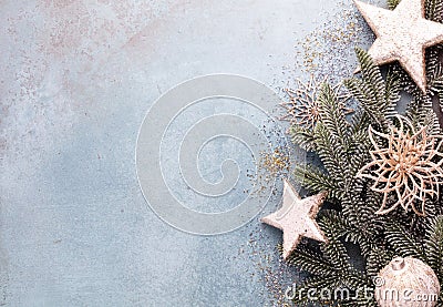 Christmas composition fir tree branches, gold sterne on blue background Stock Photo