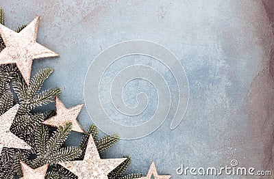 Christmas composition fir tree branches, gold sterne on blue background Stock Photo