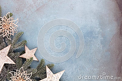 Christmas composition fir tree branches, gold sterne on blue background Stock Photo