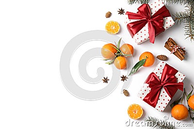 Christmas composition with gift boxes, ripe tangerines and space for text on white background Stock Photo