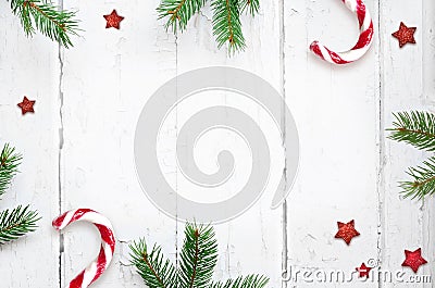 Christmas composition. Christmas gift, candy cane and fir tree branches. Top view, flat lay. Stock Photo