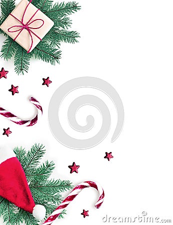 Christmas composition. Gift, fir, Christmas hat and sweet crutch on white background. Christmas, winter, new year concept. Flat Stock Photo