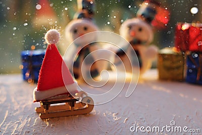 Christmas composition for greeting card. Wooden sled, Santa\'s red hat on the sled. Christmas New Year december time for Stock Photo