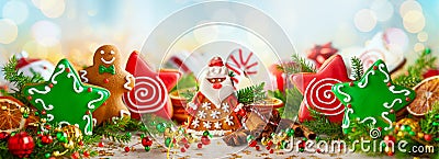 Christmas composition with Christmas handmade gingerbread cookies, winter spices and holidays decorations. Banner Stock Photo