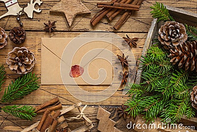 Christmas Composition with a sealed envelope over wooden table flat lay Stock Photo