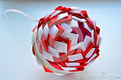 Christmas composition. Styrofoam ball decorated with satin ribbons. Handmade. Stock Photo