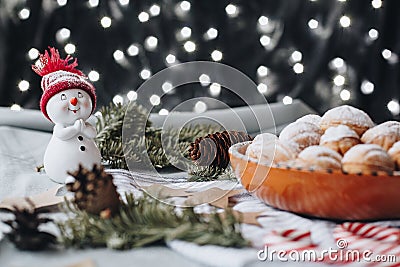 Christmas composition with a toy snowman, paper stars, cones, ch Stock Photo