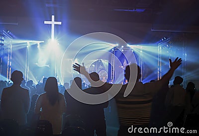 Christmas concept: Blurred Christian Congregation Worship God together in Church hall in front of music stage and light effected Editorial Stock Photo