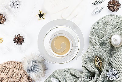 Christmas concept flat lay. Warm, cozy winter clothing and Christmas decorations frame on white background Stock Photo