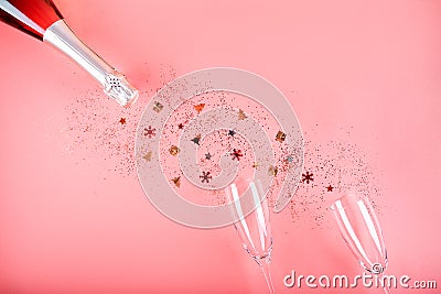 Christmas concept. Pink champagne, sparkles and a pair of glasses. Stock Photo
