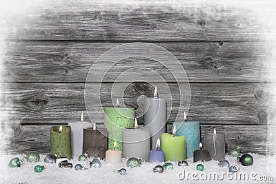 Christmas congratulatory card with many candles on wooden grey s Stock Photo