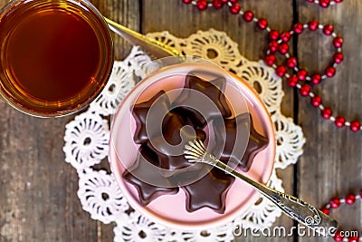 Christmas cookies - chocolate stars and cup of tea Stock Photo