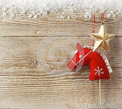 Christmas cowboy background with toy horse and star Stock Photo