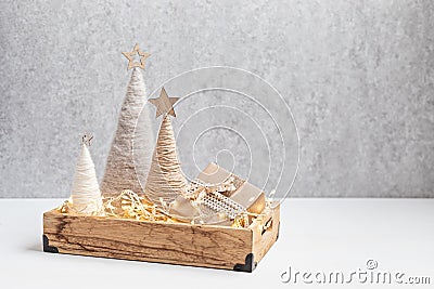 Christmas craft background with handmade yarn cone xmas trees in natural colors. Stock Photo