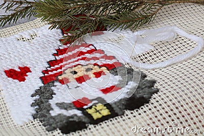 Christmas cross stitch designs and spruce. Preparing handmade gifts and decoration for New Year and Christmas Stock Photo