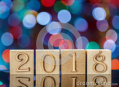 Christmas cubes on blurred blue background. Reflection. The new year 2018. Christmas Bokeh. Stock Photo