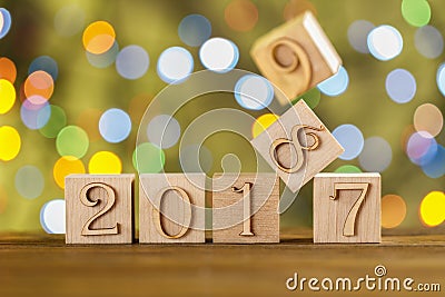 Christmas cubes. Happy New year. New 2018. Blurred green background. The flickering lights. Garlands. Stock Photo