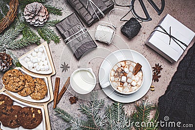 Christmas dark background. Winter cocoa with marshmallows and cookies in christmas decorations Stock Photo