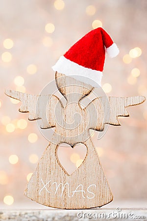 Christmas decor with angel santa hat. Vintages background. Stock Photo