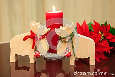 Christmas decor in modern interior. Scandinavian style, hygge. Christmas toys moose deer with red and green ropes tied around neck Stock Photo