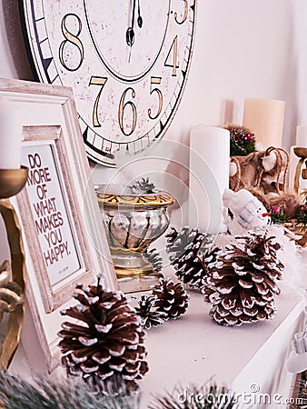 Christmas decor, New Year`s card scenery, New Year Clock with candles and photoframe. New Year concept. Stock Photo