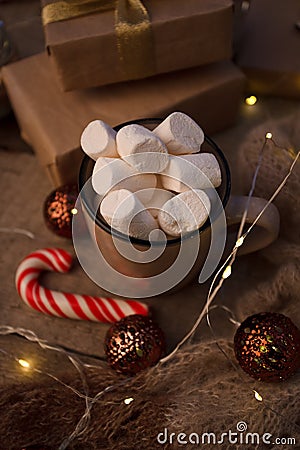 Christmas decor. still life with vintage details and Christmas decor. toy, garland and cup with hot drink and marshmallow Stock Photo