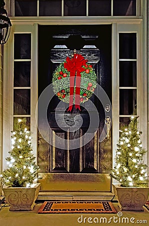 Christmas decorated front door Stock Photo