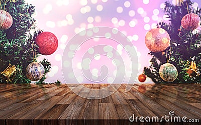 Christmas decoration background. Wooden desk with Christmas tree and Colorful Bokeh lights background Stock Photo