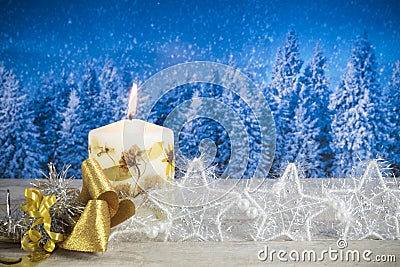 Christmas decoration with candle, golden bow, silver stars, on a Stock Photo