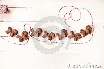 Christmas decoration chocolate cookies on table with threads Stock Photo