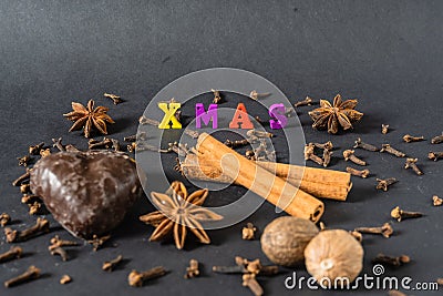 Christmas decoration with cinnamon sticks gingerbread and spices Stock Photo