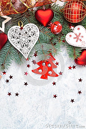 Christmas decoration collection: hearts, branches and bauble decor on stone background. Xmas backdrop for your greeting card with Stock Photo