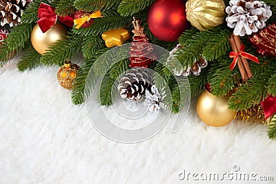 Christmas decoration on fir tree branch closeup, gifts, xmas ball, cone and other object on white blank space fur, holiday concept Stock Photo