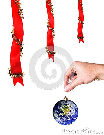 Christmas decoration and hand holding earth Stock Photo