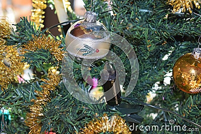 vintage Christmas decoration on an artificial tree, purple, siver and gold Stock Photo