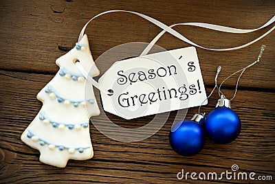 Christmas Decoration with Label with Seasons Greetings on it Stock Photo