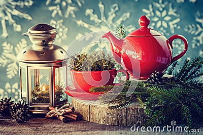 Christmas decoration: lantern, tea kettle and cup with spruce twigs Stock Photo