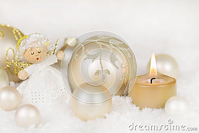 Christmas decoration with one burning candle, angel, balls in go Stock Photo