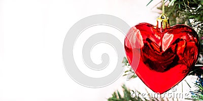Christmas decoration in the shape of a heart on a tree. Copy space Stock Photo
