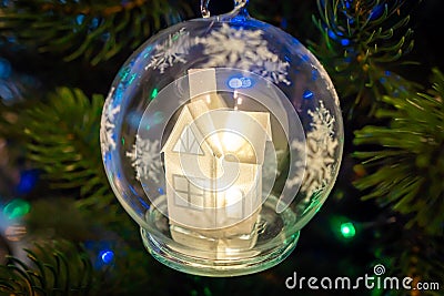 Christmas decoration for Christmas tree snow glowing fairy house in a glass bowl Stock Photo