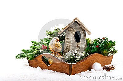 Christmas decorations: bird, birdhouse and fir tree branches Stock Photo