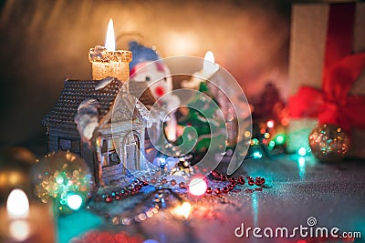 Christmas decorations, burning candles, garlands, lights, balls Stock Photo