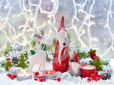 Christmas decorations cute figure elk and gnomes with festive decorations Ð¾n the snow. Christmas or New Year greeting card Stock Photo