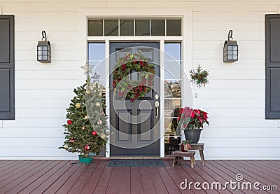 Christmas Decorations At Front Door of House Stock Photo