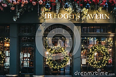 Christmas decorations on Mr. Fogg`s Tavern in Covent Garden, London, UK Editorial Stock Photo